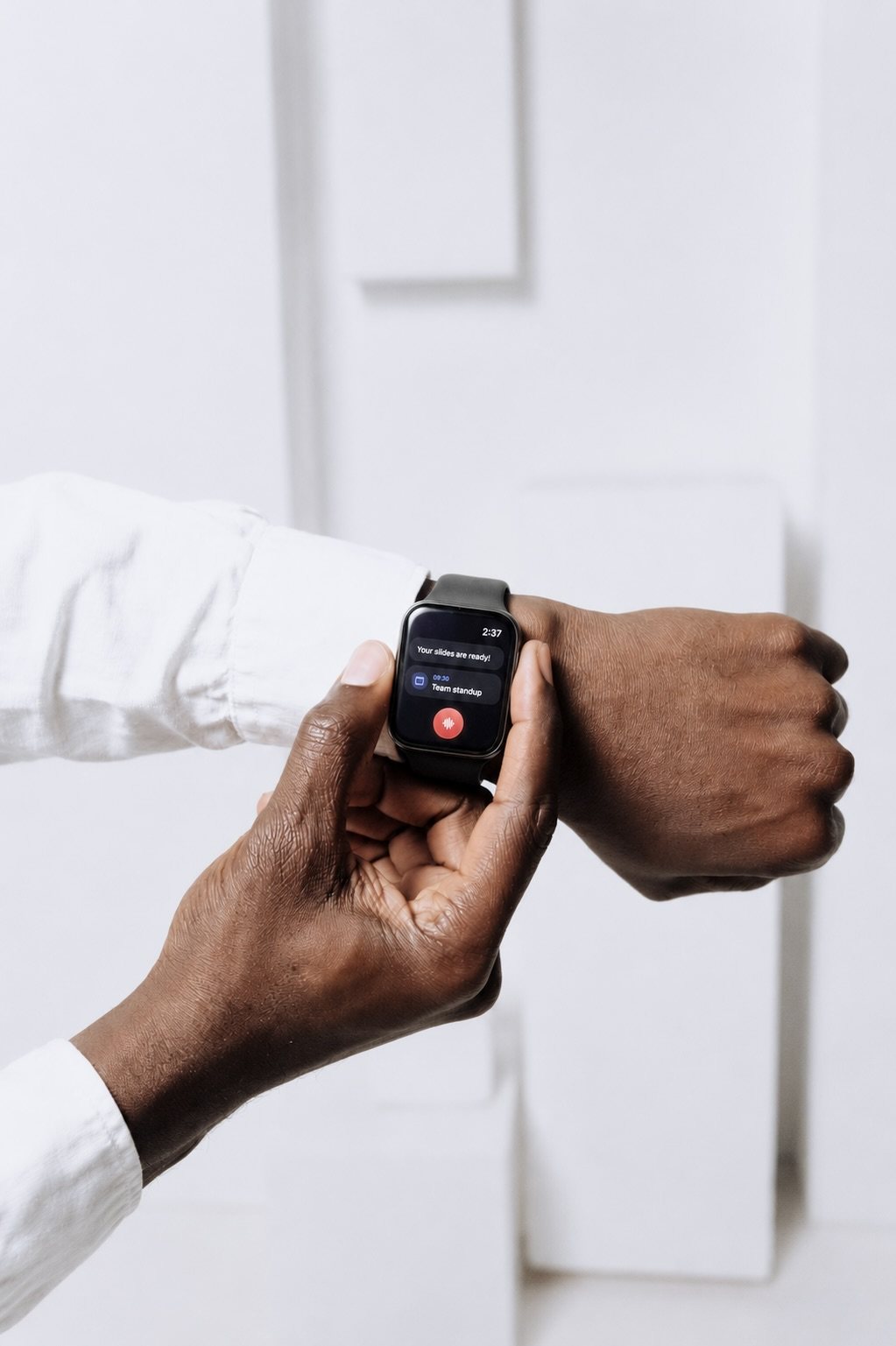 An Apple Watch on a wrist showing Kinda.Cool